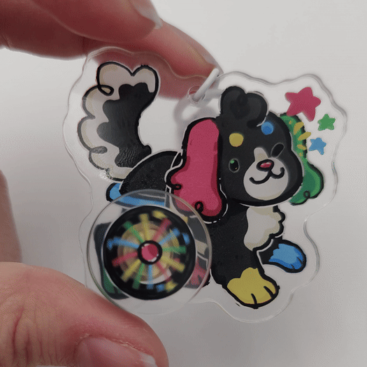 dash spinning acrylic charm by woolblossom