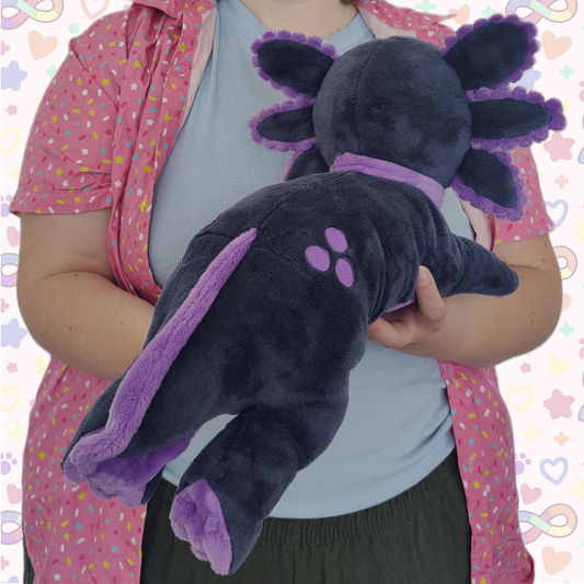 kelly the schizospec axolotl laying cuddle plushie!